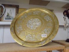 A large 19/20th century Cairoware Mamluk brass charger/tray decorated with white metal and copper,