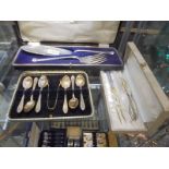 A cased pair of fish servers (maker D & A), a set of 6 spoons with sugar tongs & two pickle forks.