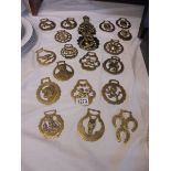 Twenty assorted horse brasses.