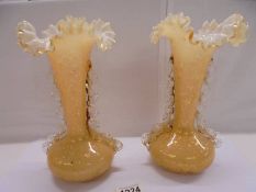 A pair of antique gilt fleck glass vases, 24 cm. No cracks or chips.