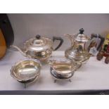 A four piece silver tea set, approximately 49 ounces.