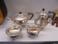 A four piece silver tea set, approximately 49 ounces.