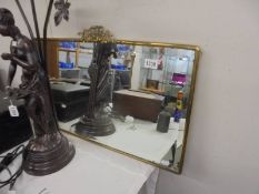 A bevel edged mirror in good brass frame, COLLECT ONLY.