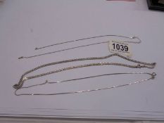 Three silver neck chains, one a/f. 17 grams.
