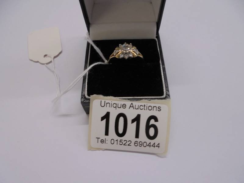 A yellow gold cluster ring, marked 10k, size Q, 3.2 grams.
