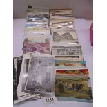 A mixed lot of mainly Lincolnshire postcards and photographs.