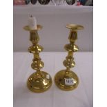 A pair of good quality brass candlesticks.