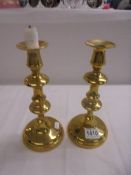 A pair of good quality brass candlesticks.