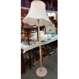 A vintage painted floor standing lamp standard