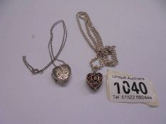 A silver heart pendant and a silver locket, 26.5 grams.