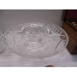 A large cut glass bowl on three feet, 31.5CM diameter.