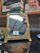 An art deco style brass framed mirror height 24cm, width 17.5cm