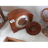 A 1930's oak mantle clock, no pendulum and a bowl made of teak from HMS Spartiate