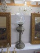 A brass oil lamp with shade, COLLECT ONLY.