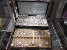 A cased set of 12 cake forks and a cased set of 12 teaspoons.