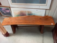 A rustic oak sliced tree trunk bench, length 138cm COLLECT ONLY