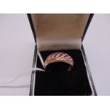 A yellow gold ring marked 585 set rubies?, size P half, 5.4 grams.