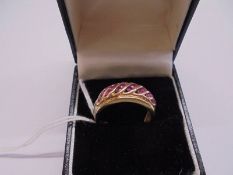 A yellow gold ring marked 585 set rubies?, size P half, 5.4 grams.