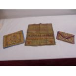 A unframed 1824 sampler and two other embroidered items.