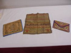 A unframed 1824 sampler and two other embroidered items.