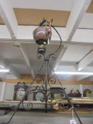 An old copper kettle on wrought iron stand complete with burner, COLLECT ONLY.