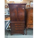 A mahogany drinks cabinet in the style of a Victorian linen press. COLLECT ONLY.
