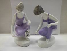 A pair of contemporary Hungarian female figures.