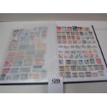 A stamp album with several complete pages of world stamps.