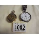 A silver fob watch a/f (no glass or minute hand) and a yellow metal fob watch.