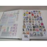 A stamp album mostly complete with only a few missing stamps from around the world.