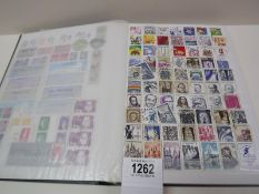 A stamp album mostly complete with only a few missing stamps from around the world.