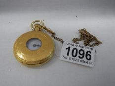 A gold plated half hunter pocket watch by Limit, on chain and in working order.