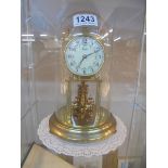 An anniversary clock under dome, COLLECT ONLY, in working order.