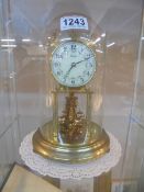 An anniversary clock under dome, COLLECT ONLY, in working order.