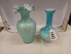 An antique blue satin glass vase, 17 cm tall and an antique blue satin glass vase, 15 cm tall.