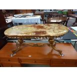 A Vintage oval coffee table on brass base and with onyx top. COLLECT ONLY.