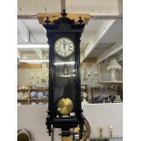 A black carved Vienna single weight wall clock