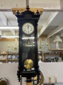 A black carved Vienna single weight wall clock