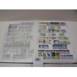 A stamp album with several complete pages of world stamps.