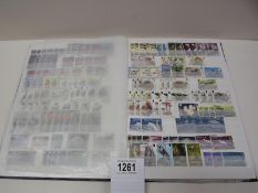 A stamp album with several complete pages of world stamps.