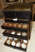 A watchmakers cabinet and contents
