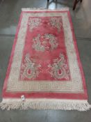 A Chinese rug decorate with dragons, 155 x 92cm. COLLECT ONLY.