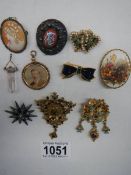 A good lot of vintage brooches including cameo, photo pendant etc.,