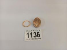 A 9ct gold locket (5.3gms) & a 9ct gold piece of scrap gold (1.43gms)