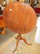 A circular mahogany tip top table on tripod base, COLLECT ONLY.