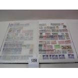 Several complete pages of stamps from around the world.