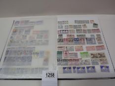 Several complete pages of stamps from around the world.