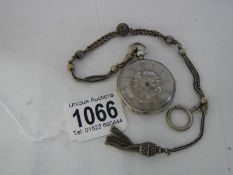 A Victorian chatelain chain together with a silver cased pocket watch.