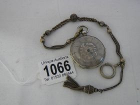 A Victorian chatelain chain together with a silver cased pocket watch.