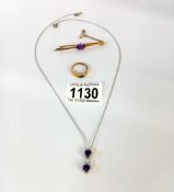 A 10ct gold ring with blue stone (2.64gms). A 15ct gold bar brooch with amethyst (4.97gms) & a white